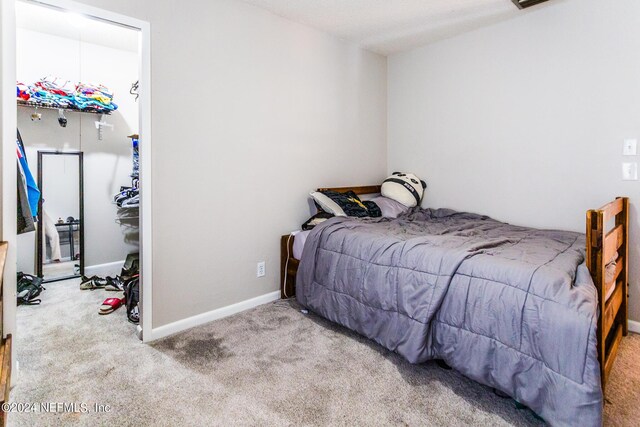 bedroom featuring carpet