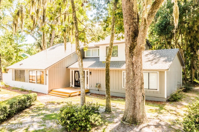 rear view of house featuring a deck