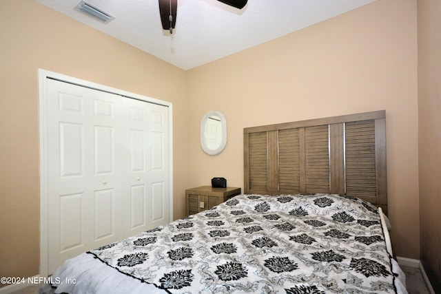 bedroom featuring ceiling fan and a closet