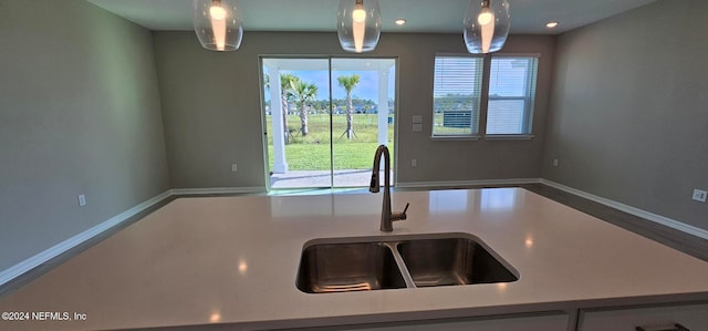 kitchen with sink and decorative light fixtures