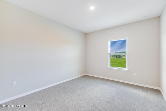 unfurnished room featuring carpet flooring