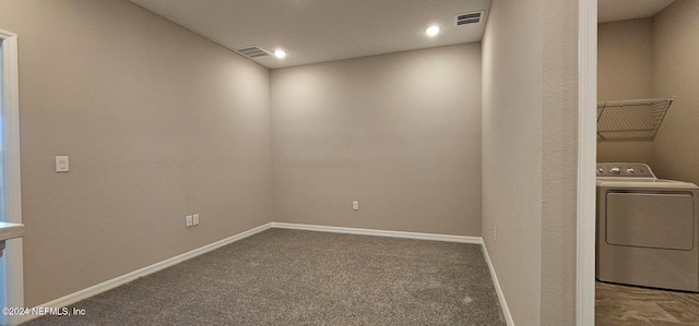 interior space featuring washer / clothes dryer and carpet