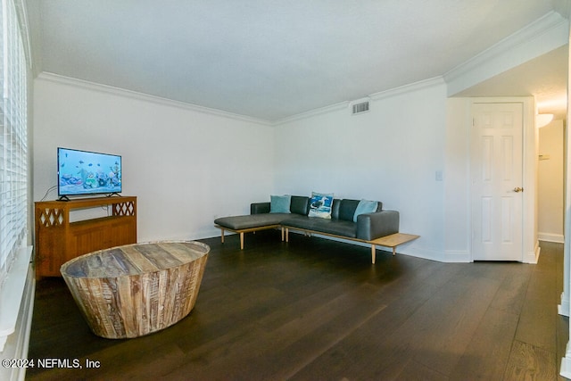 living room with ornamental molding and dark hardwood / wood-style floors