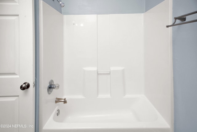 bathroom with shower / washtub combination