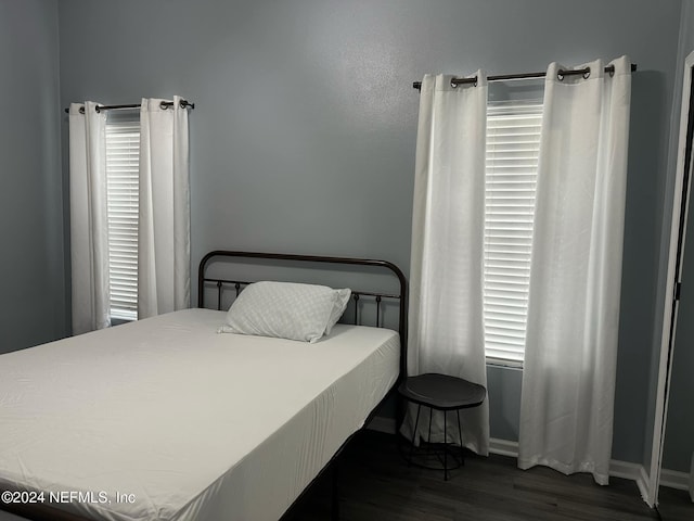 bedroom featuring dark hardwood / wood-style floors