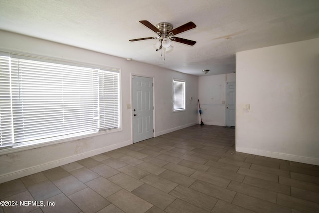 entryway featuring ceiling fan