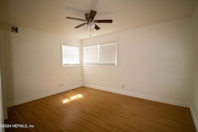 spare room featuring ceiling fan and wood-type flooring