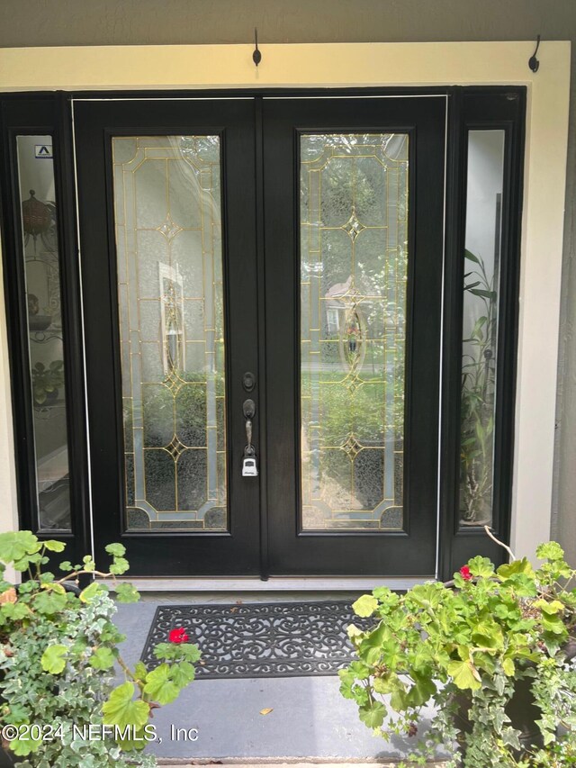 entrance to property featuring french doors