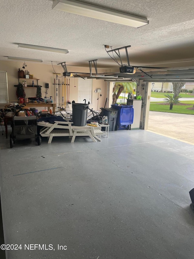 garage featuring a garage door opener