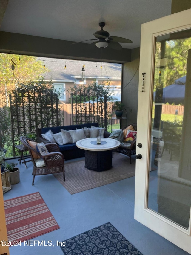 view of patio featuring an outdoor hangout area and ceiling fan