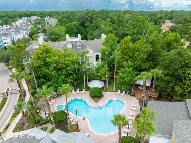 view of pool with a patio area and a residential view