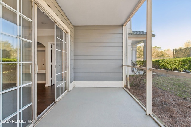 unfurnished sunroom with french doors