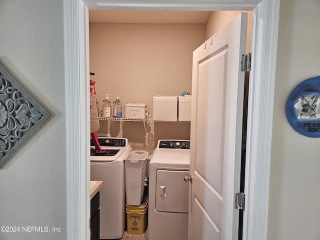 clothes washing area featuring laundry area and washing machine and dryer