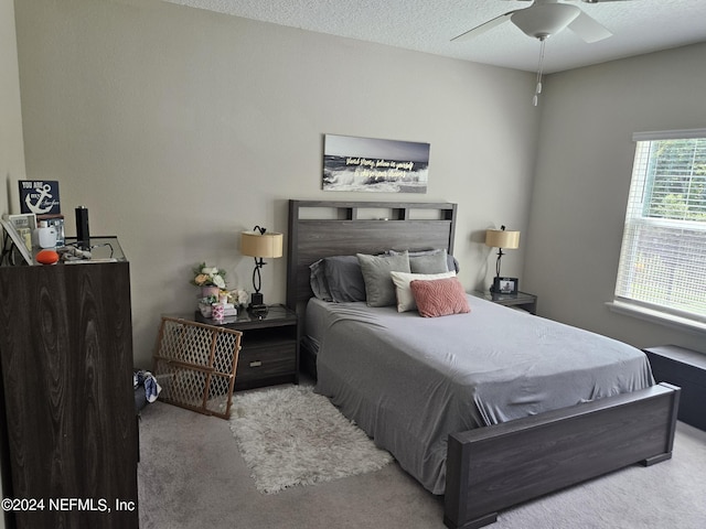 carpeted bedroom featuring a textured ceiling