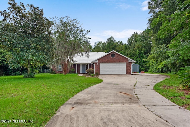 single story home featuring a front yard and a garage