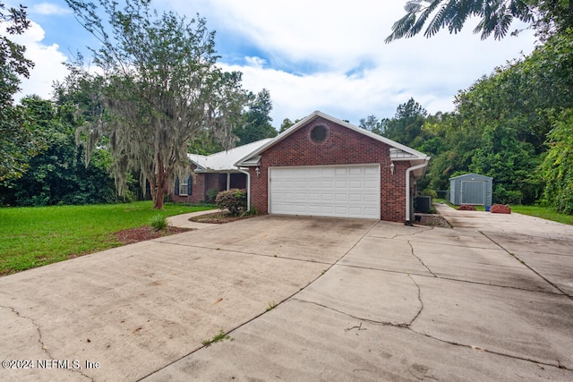 view of side of property with a garage and a yard