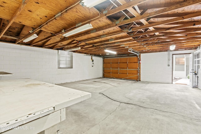 garage featuring concrete block wall