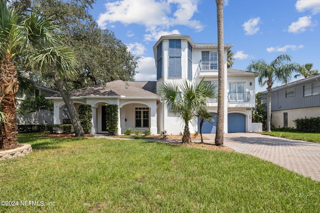 view of front of house featuring a garage and a front yard