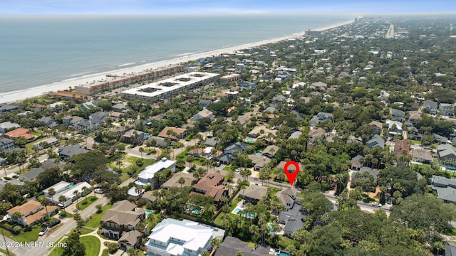 drone / aerial view with a water view and a view of the beach