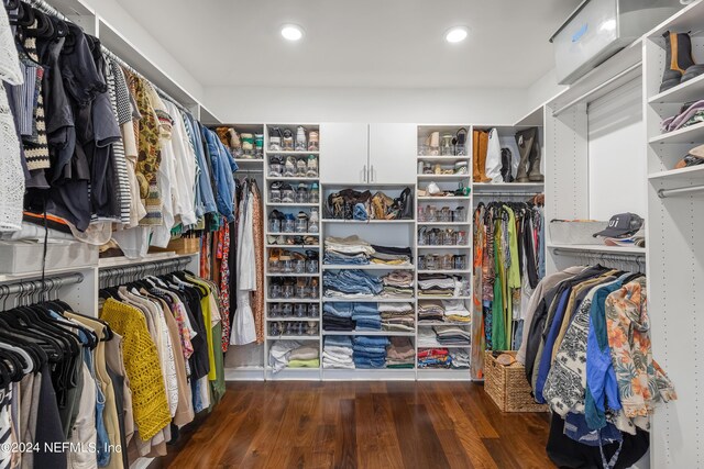 walk in closet featuring dark wood-type flooring