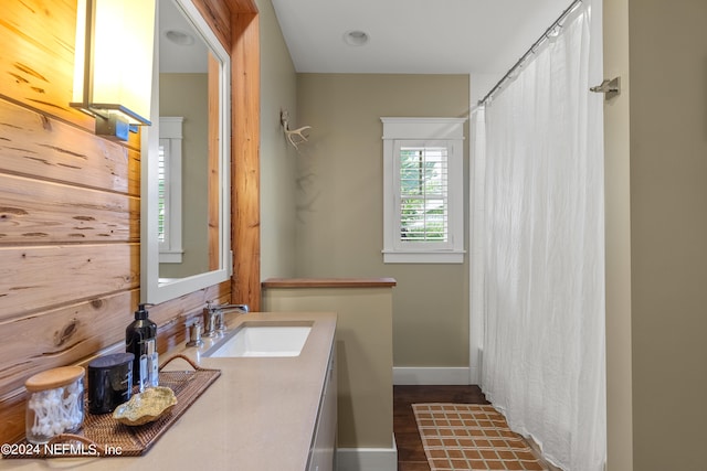 bathroom with vanity and hardwood / wood-style flooring