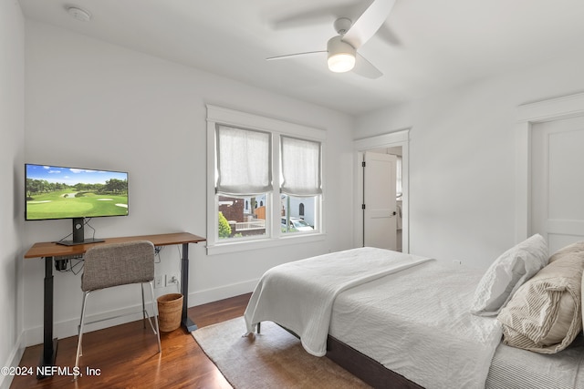 bedroom featuring ceiling fan and dark hardwood / wood-style flooring