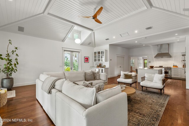 living room with ceiling fan, dark hardwood / wood-style floors, wooden ceiling, and lofted ceiling with beams