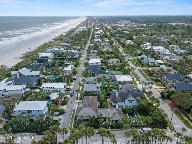 bird's eye view with a water view and a view of the beach