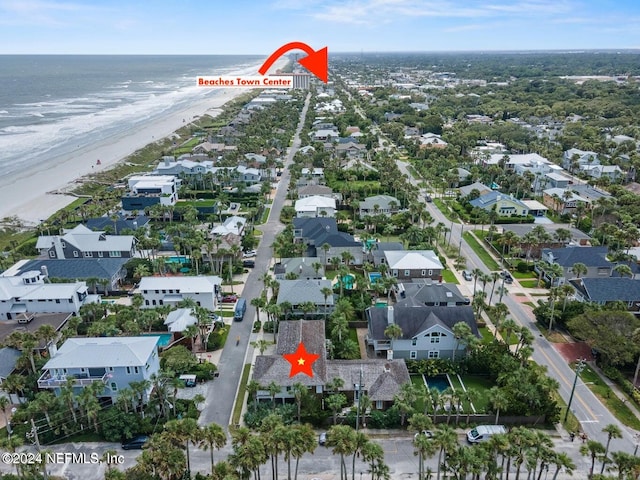 bird's eye view with a beach view and a water view