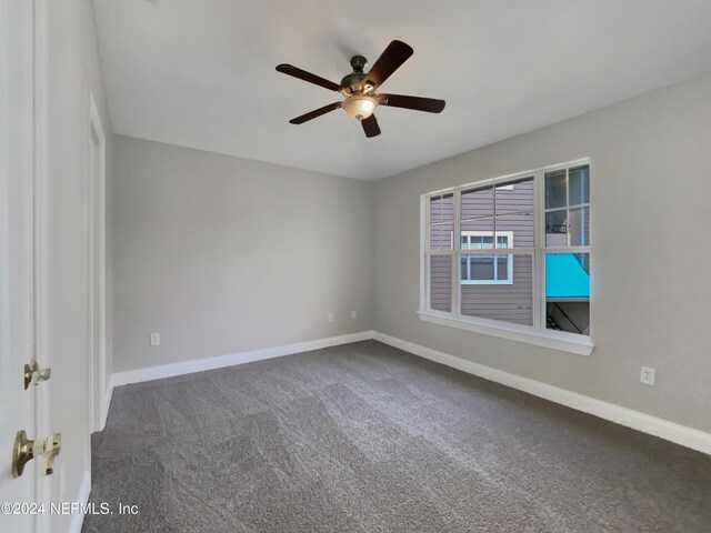 carpeted empty room with ceiling fan