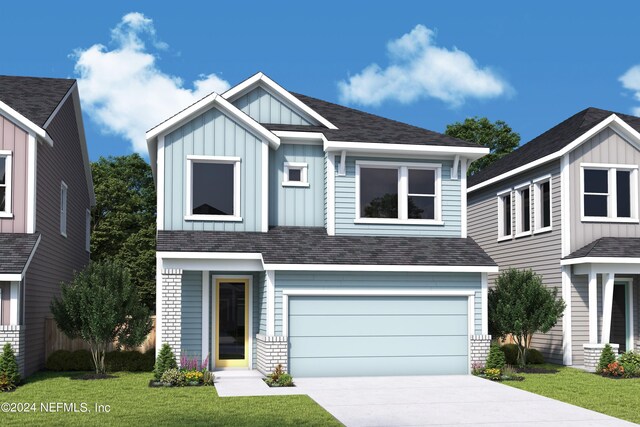 view of front of home with a garage and a front yard