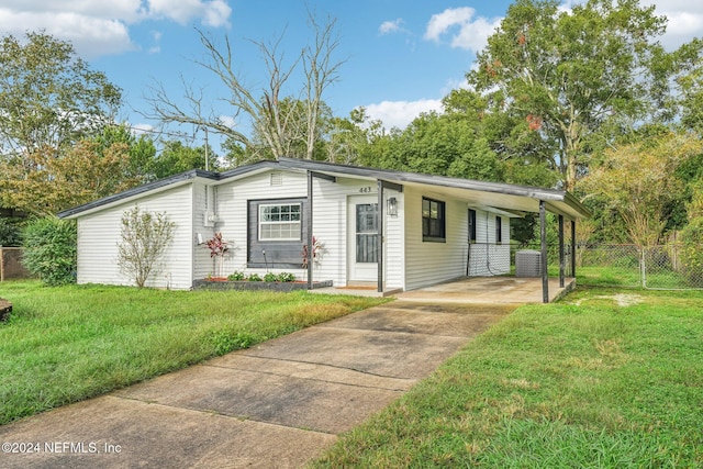 ranch-style house featuring a carport and a front yard