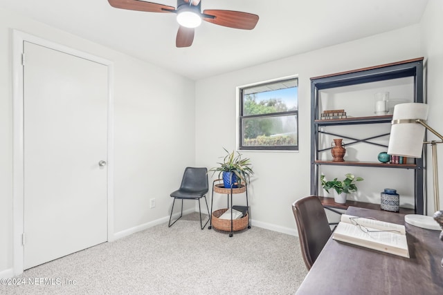 home office with light carpet and ceiling fan