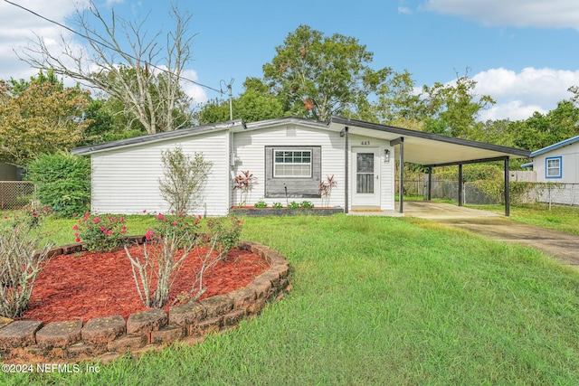 exterior space with a yard and a carport