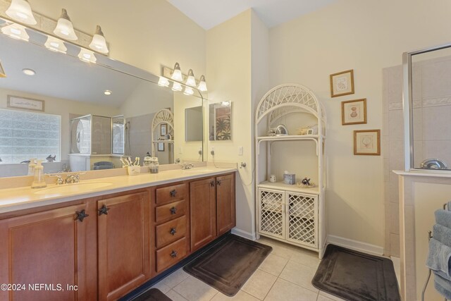 bathroom featuring dual vanity and tile patterned floors