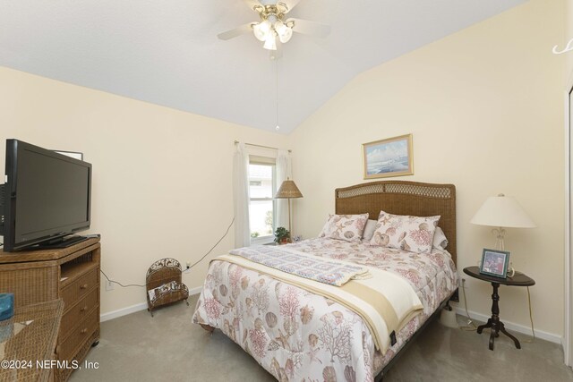 carpeted bedroom featuring ceiling fan and lofted ceiling