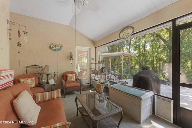 sunroom with ceiling fan and vaulted ceiling