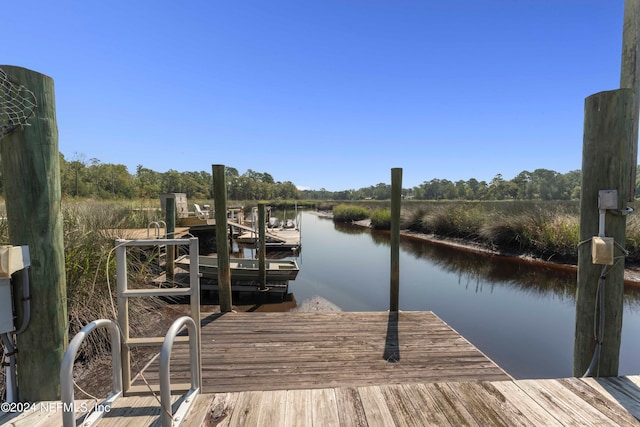 view of dock with a water view