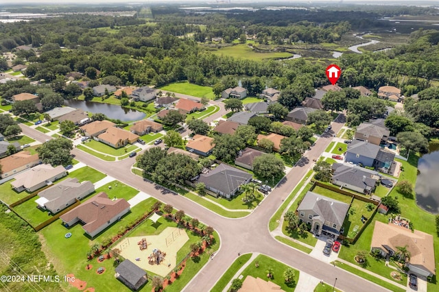 bird's eye view featuring a water view and a residential view