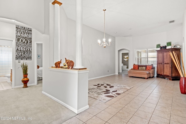 interior space featuring light tile patterned floors and a chandelier