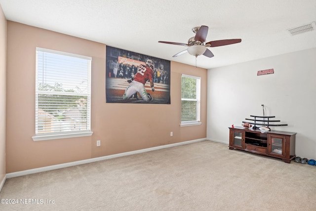 carpeted empty room with ceiling fan