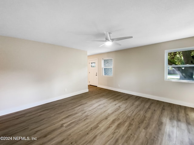 empty room with ceiling fan and wood-type flooring