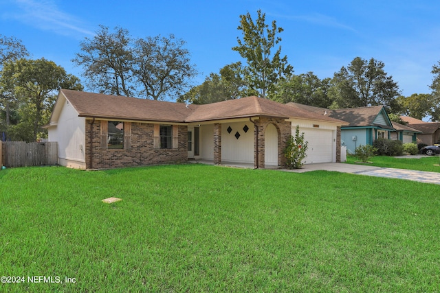 single story home with a front lawn and a garage