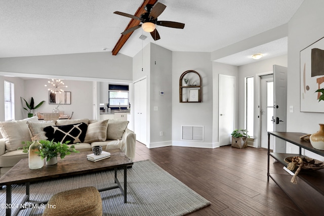 living room featuring a textured ceiling, vaulted ceiling with beams, ceiling fan with notable chandelier, and dark hardwood / wood-style floors