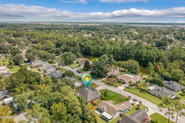 birds eye view of property featuring a residential view and a forest view