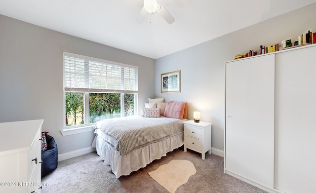 carpeted bedroom featuring ceiling fan