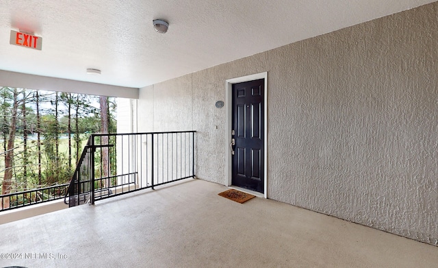 entrance to property featuring a balcony