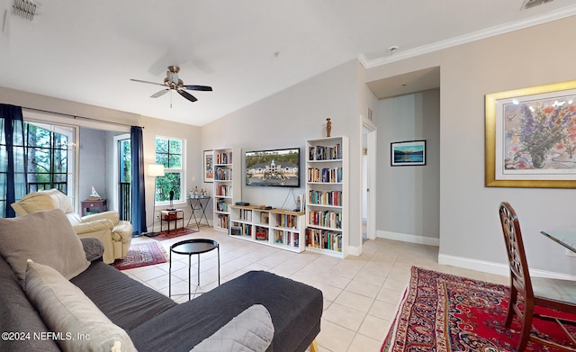 living room with light tile patterned flooring, ornamental molding, vaulted ceiling, and ceiling fan