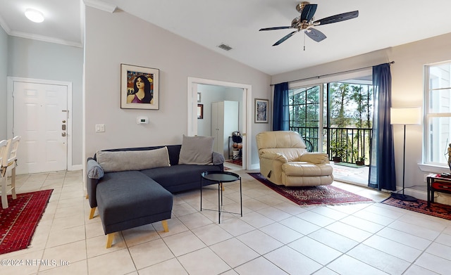 tiled living room featuring ceiling fan, ornamental molding, vaulted ceiling, and a wealth of natural light