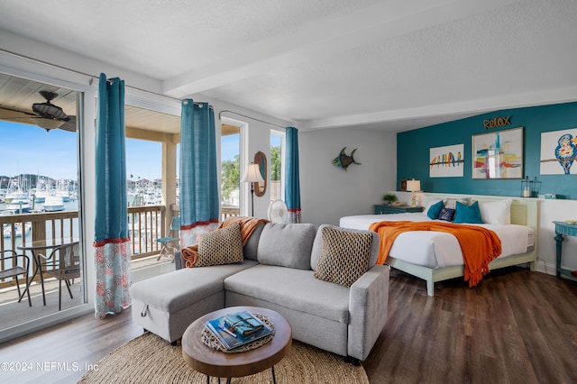 bedroom featuring hardwood / wood-style floors, access to outside, a textured ceiling, and beamed ceiling